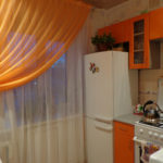 Orange curtain on the kitchen window