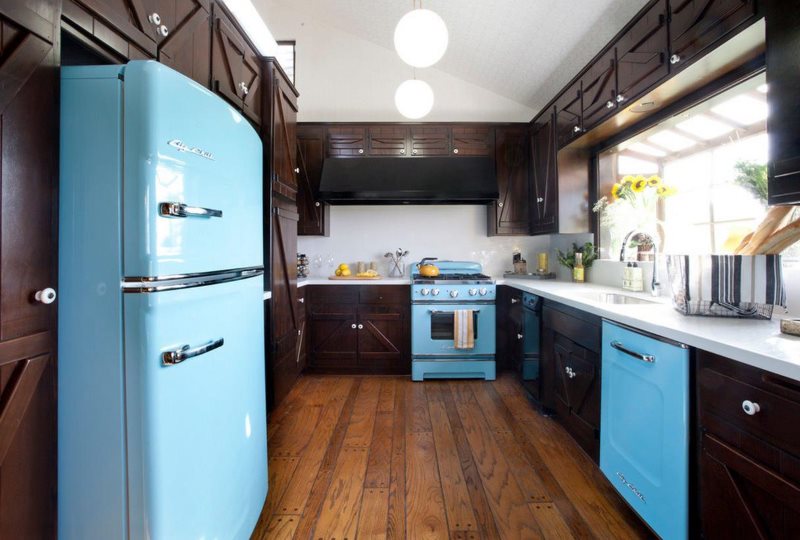 Blue refrigerator with pot-bellied doors in the kitchen in retro style