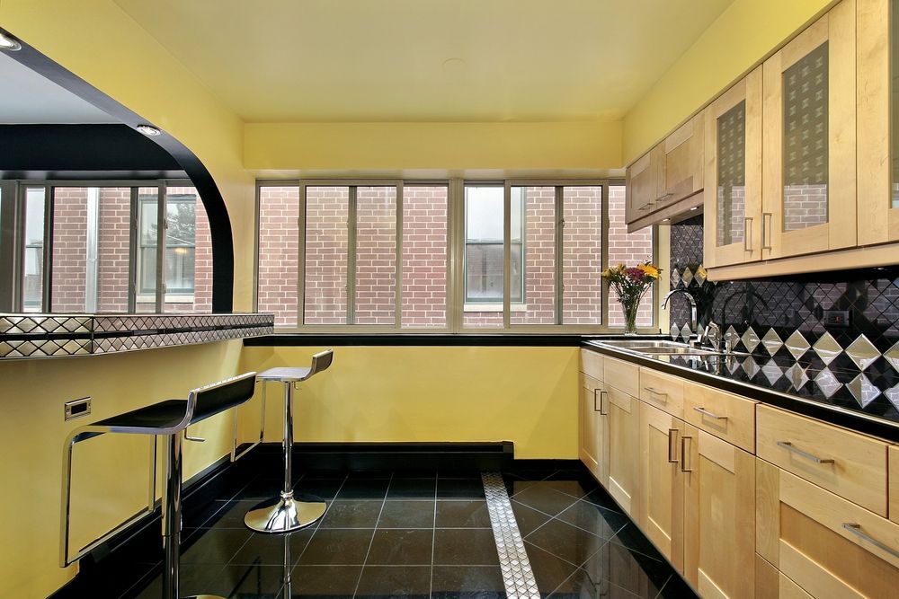 Black kitchen floor with simple ceiling