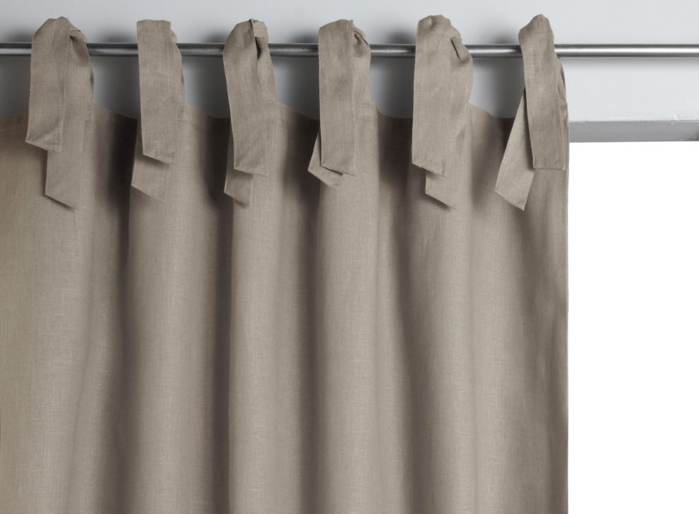 Gray curtain with ties on a metal cornice