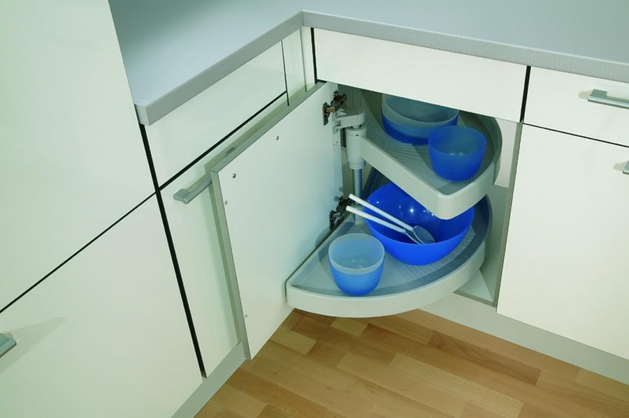 Swivel shelves in the corner module of the kitchen cabinet