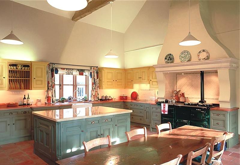 Victorian style kitchen interior with high ceiling.