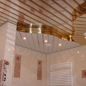 Two-level ceiling made of slatted PVC panels