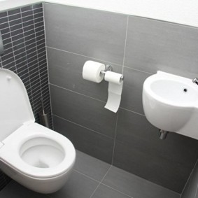 Corner sink on a gray wall