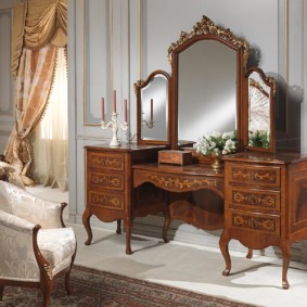 Natural wood dressing table in a classic style bedroom