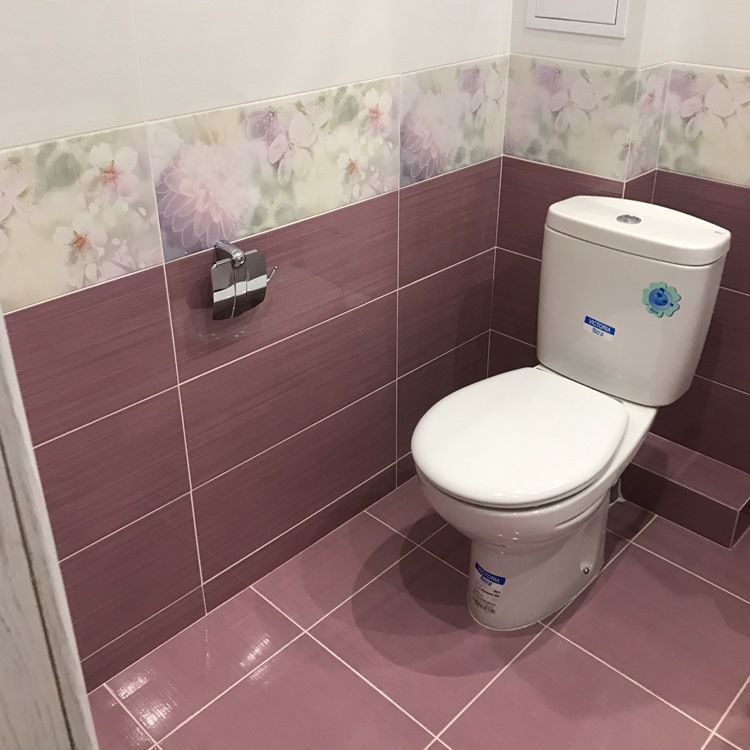 Compact white toilet in Khrushchev's toilet