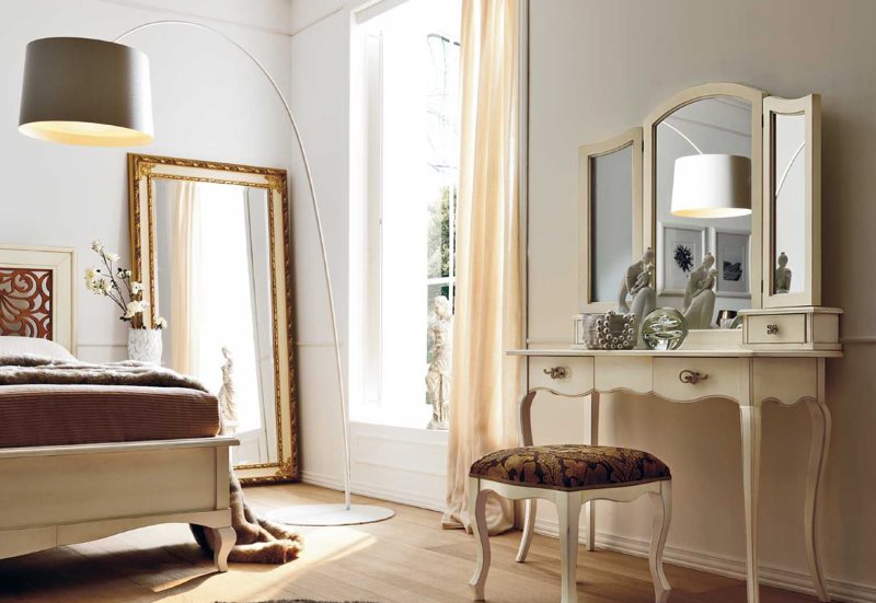 Large mirror on the bedroom floor with dressing table