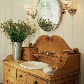 Porcelain sink in a wooden chest of drawers