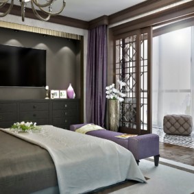 Purple curtains in an art deco style bedroom