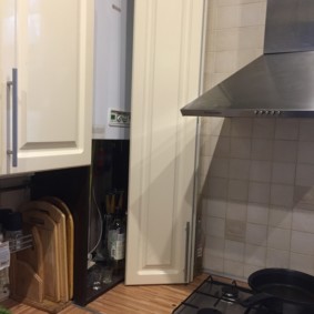 An example of masking a geyser inside kitchen furniture