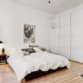 Bright bedroom with wooden floor