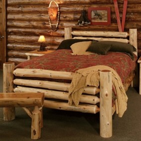 Rustic bed made of thin logs