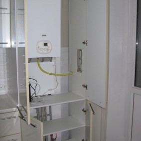 Open cabinet doors with gas boiler
