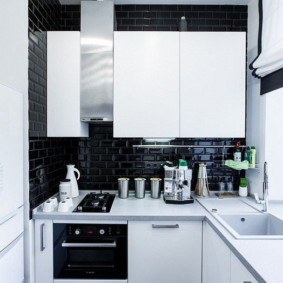 White cabinets on a dark wall