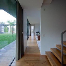 Wooden floor in the hallway with panoramic windows