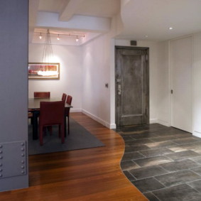 combination of tile and laminate in the hallway interior photo