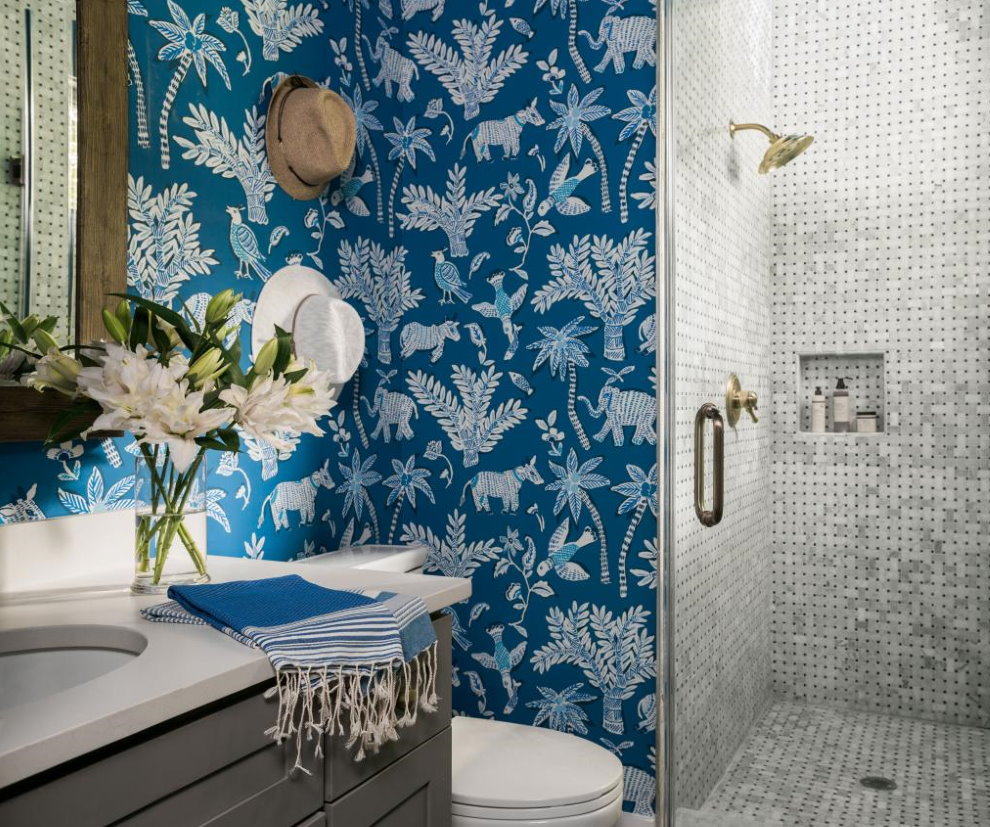 Bathroom with shower and wallpaper on the wall