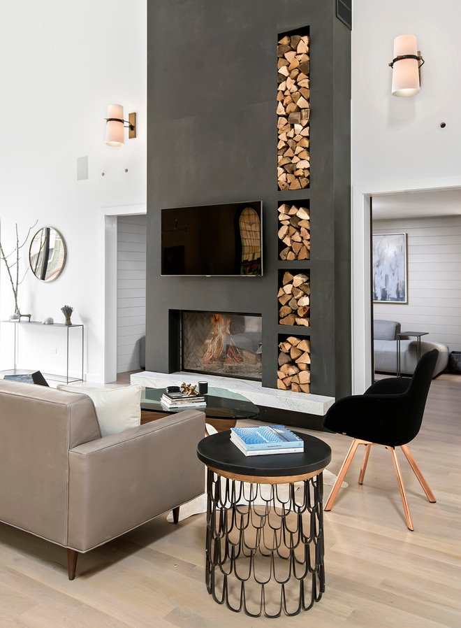 Firewood in a fireplace portal in a modern style living room