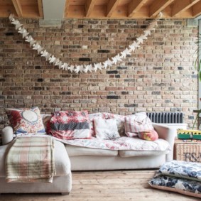 Sofa in a room with brickwork