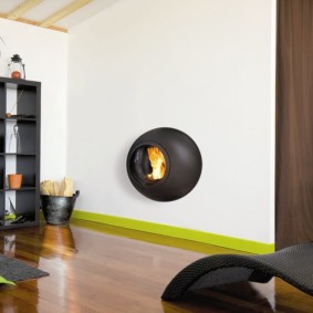 Spherical fireplace on a white wall