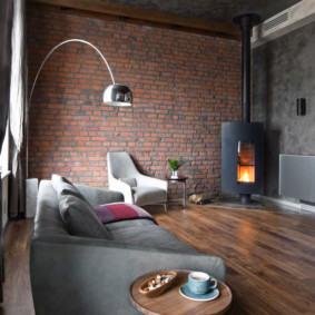 Metal fireplace in a loft style living room