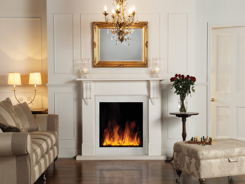 Mirror in a gold frame over the fireplace in the hall