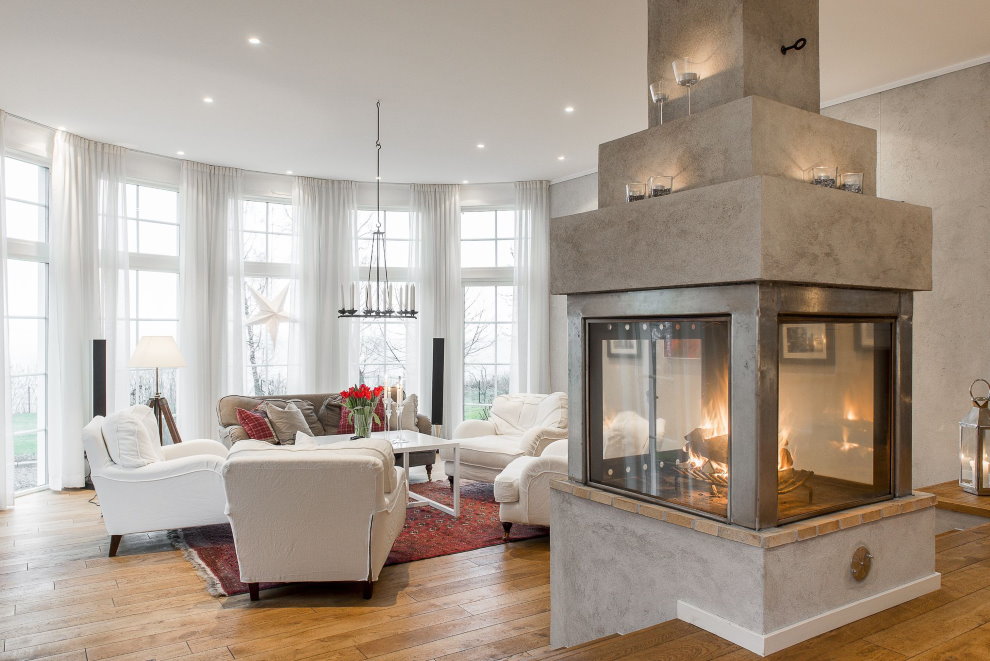 Island fireplace in the living room with white walls