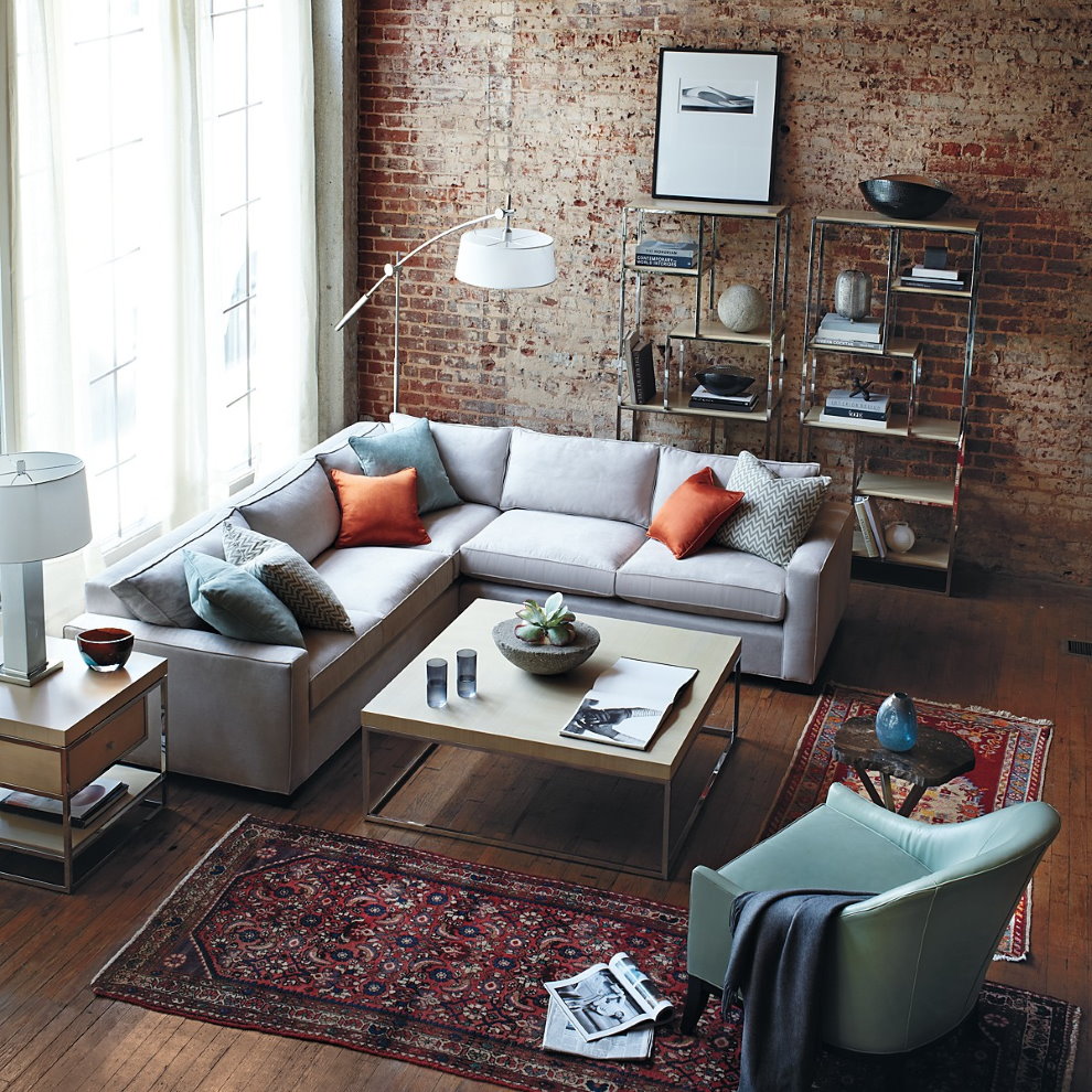 Corner sofa in the living room with brick wall.