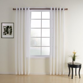 curtains on the grommets in the living room interior ideas