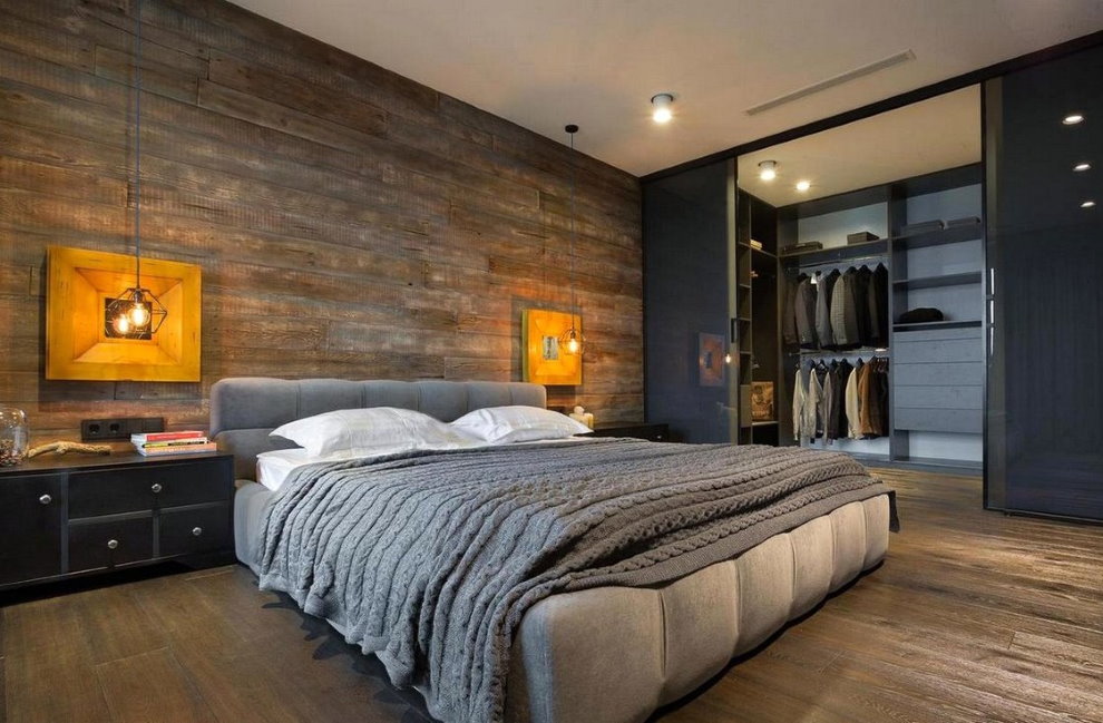 Wide bed in the loft style bedroom