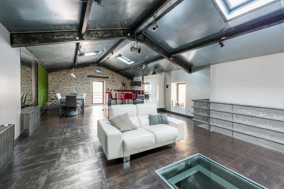 Steel beams on the ceiling of the living room in a loft style