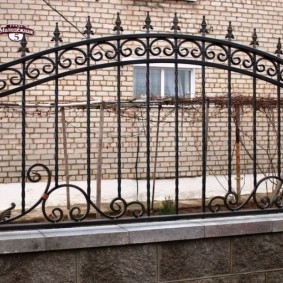 Combined metal and stone fence