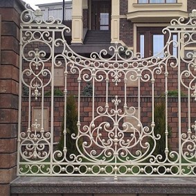 White fence made of forged elements