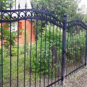 Forged fence on metal poles