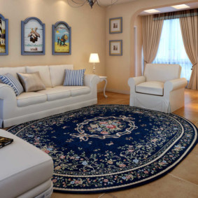 Upholstered furniture in the hall with an oval carpet