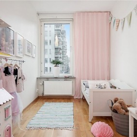 Pink curtain on the window of a room for a girl