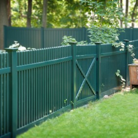 Green wooden fence picket fence