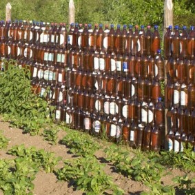 Country fence made of plastic bottles