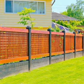 Contemporary fence with wooden sections
