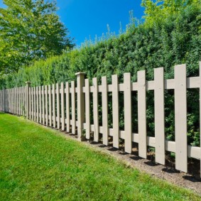 Simple fence made of wide pine boards