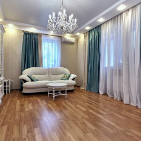 Double curtains in the hall with wooden floor
