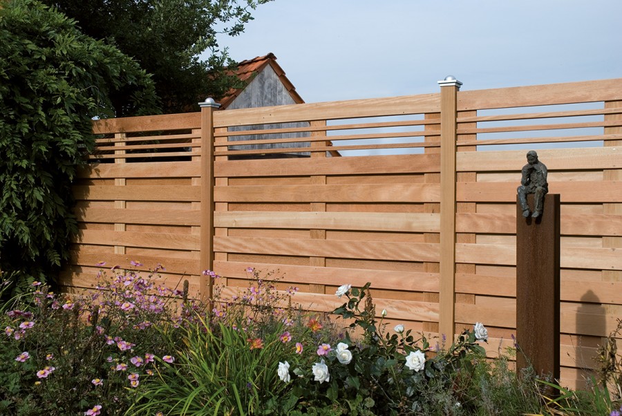 Stylish fence made of wooden boards