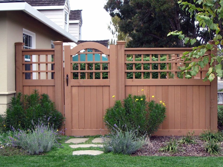 Wooden fence with trellised top in the yard