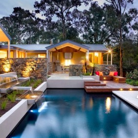Landscaped relaxation area on a plot with a pool