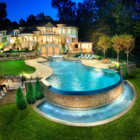 Large pool with a waterfall in the garden