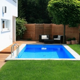Ground lawn on a plot with a swimming pool