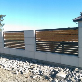 New fence in front of a house under construction