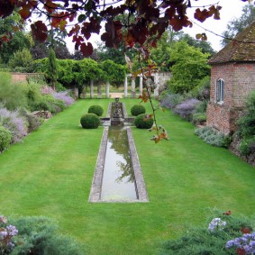 Narrow pond in a classic style garden