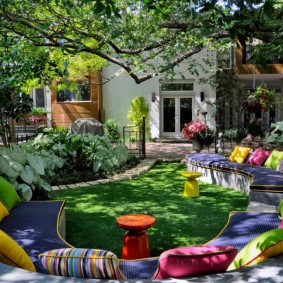 Multi-colored pillows on garden furniture