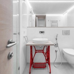 White sink on a red frame